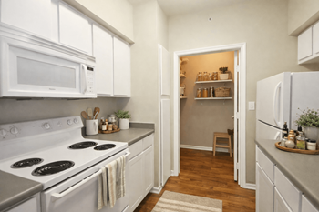 White galley kitchen with pantry